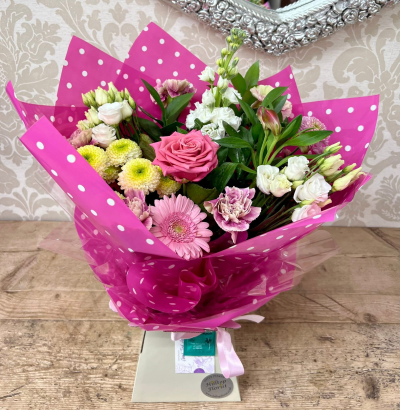 Colour Pop - A lively and colourful bouquet with a mix of pink, white, and green flowers, wrapped in paper.