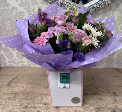 Lilac Boxed Hand Tied - A lilac and green hand tied boxed bouquet, perfect for that special occasion.